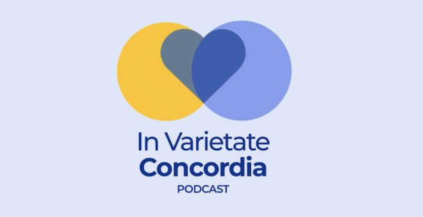 A blue and yellow circle intersect on a light blue background to form a heart, with the name of the podcast 'In Varietate' stated underneath.