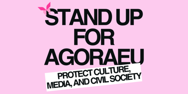 Graphic on a pink background with a small pink butterfly-shaped logo at top left. Large black text reads “Stand up for AgoraEU.” A tilted white label below reads “Protect culture, media, and democracy.”